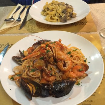 Da Guiseppe - Yummy!  Spaghetti allo Scoglio (mussels, clams, and shrimps) and Tagliatelle al Funghi Porcini (mushrooms). - Italian Near Me - Rome, RM