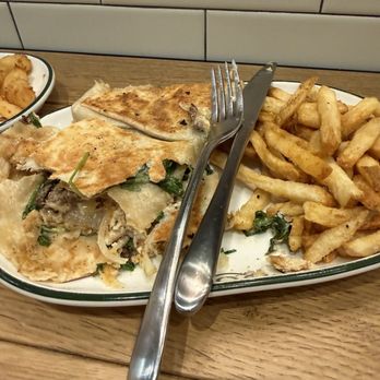 Truce - My hand held that was placed in a wrap. Salty, soggy, and greasy . They should have never flattened and fried it. - American Near Me - Brentwood, Tennessee