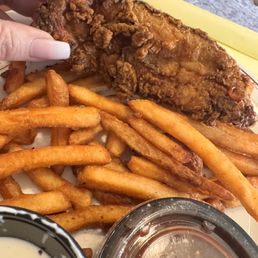 Delivery Chicken tenders and fries with homemade ranch and barbecue sauce. Delivery Chicken tenders and fries with homemade ranch and barbecue sauce.