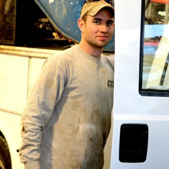 United Structural Systems - Daniel Givens, project foreman, wipes his truck down at the end of the day. - Waterproofing Near Me - Pleasant View, Tennessee United Structural Systems - Daniel Givens, project foreman, wipes his truck down at the end of the day. - Waterproofing Near Me - Pleasant View, Tennessee