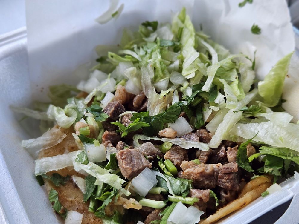 Taquiera El Gallito Logo