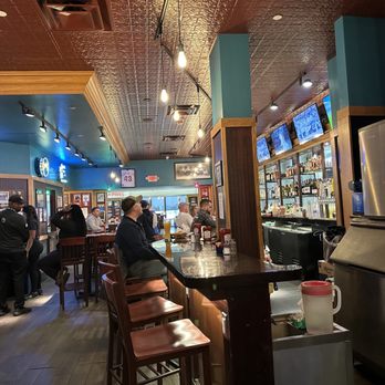 Chickie's & Pete's - people sitting at the bar - New American Near Me - Philadelphia, Pennsylvania