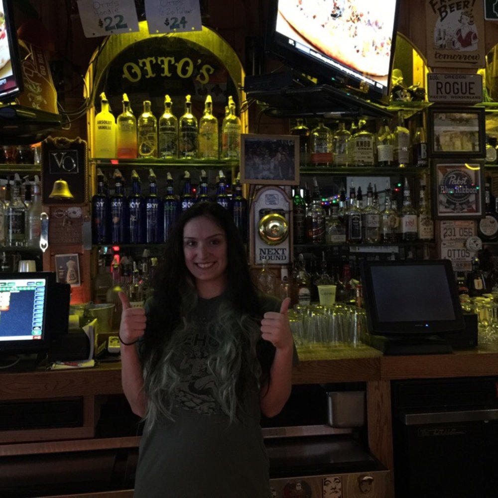 Otto's Bar & Grill - a woman standing in front of the bar - Bars Near Me - Lombard, Illinois