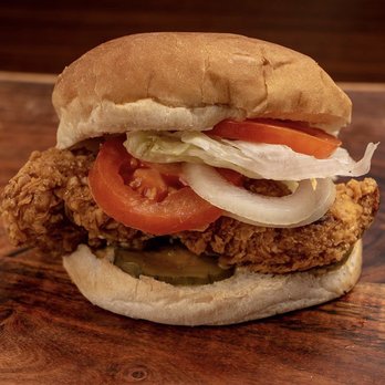 Captain Hooks - a fried chicken sandwich with tomatoes and onions - Chicken Wings Near Me - Dothan, Alabama Captain Hooks - a fried chicken sandwich with tomatoes and onions - Chicken Wings Near Me - Dothan, Alabama