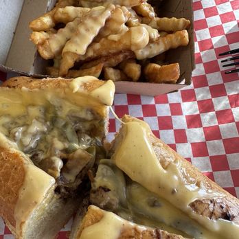 West Coast Cheesesteaks - West Coast cheesesteak with yellow cheddar cheese and cheesy fries - Cheesesteaks Near Me - Glendora, California