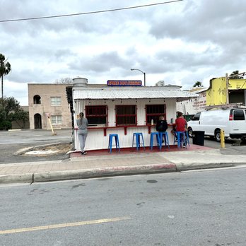 Space Dog Station - two people sitting at a table - Hot Dogs Near Me - Brownsville, Texas Space Dog Station - two people sitting at a table - Hot Dogs Near Me - Brownsville, Texas