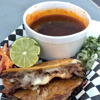 Jefita's kitchen - Birria QuesaTaco with a side of consome - Mexican Near Me