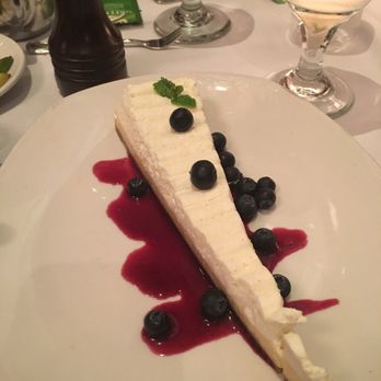 Atlantic Fish - Key Lime pie with berries and over raspberry sauce.  Perfect flavor, light and creamy - worth the calories! - Seafood Near Me - Boston, Massachusetts