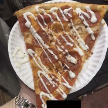Eagles Pizza Downtown - a slice of pizza on a paper plate - Pizza Near Me - Orlando, Florida Eagles Pizza Downtown - a slice of pizza on a paper plate - Pizza Near Me - Orlando, Florida