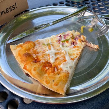 Big Daddy Bagels - a slice of pizza on a plate - Bagels Near Me - Golden, Colorado