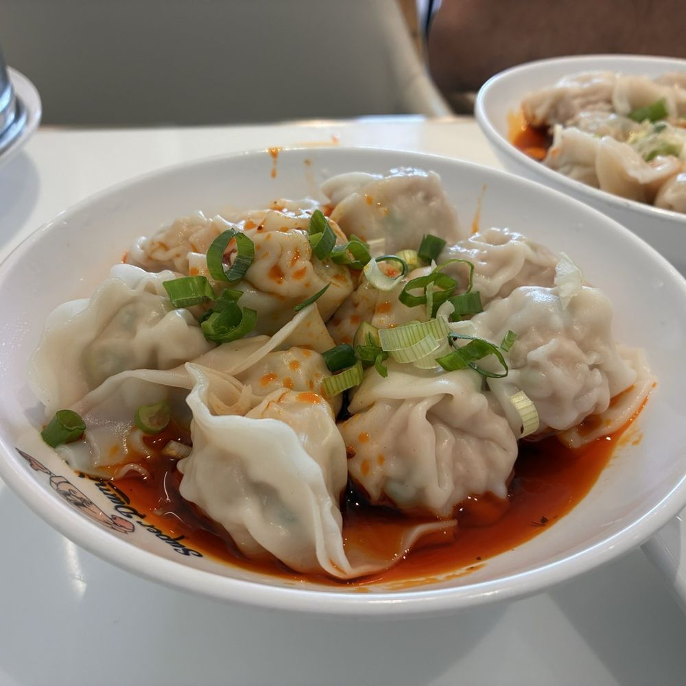 Super Dumpling - Beautifully wrapped Chicken Wontons in a spicy chili soup topped off with green onions!! - Noodles Near Me - Orange, California
