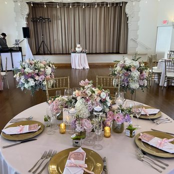 Breezy Day - Head Table. Heather suggested recycling ceremony flowers for reception tables! A wonderful idea to save money - Wedding Planning Near Me
