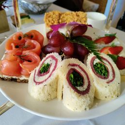 Smoked salmon with cream cheese on rye, pastrami with watercress (my favorite), strawberry with cheese, and can't remember the last one. Smoked salmon with cream cheese on rye, pastrami with watercress (my favorite), strawberry with cheese, and can't remember the last one.