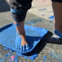 Fremont Parent Co-Op Nursery School - Fun splashing and painting with feet!