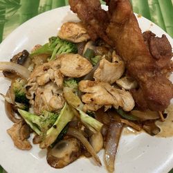 Hibachi chicken and vegetables and chicken skewers.
