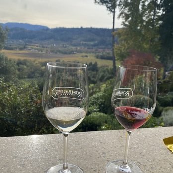 Rombauer Vineyards - Tastings in foreground and view in background. - Wineries Near Me - St. Helena, California Rombauer Vineyards - Tastings in foreground and view in background. - Wineries Near Me - St. Helena, California