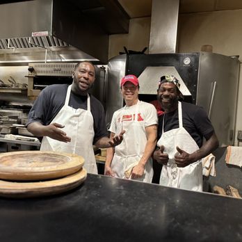 Cochon RESTAURANT - Ervin, Chad and Liam. They are working a wood fire oven and are a big part of the food going out. Everything is delicious!! - Cajun/Creole Near Me - New Orleans, Louisiana