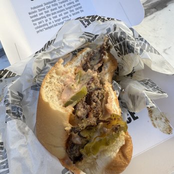 NADC Burger - Half eaten burger - Burgers Near Me - Austin, Texas NADC Burger - Half eaten burger - Burgers Near Me - Austin, Texas