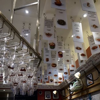 L'Avant Comptoir - Menu items hanging from the ceiling - Tapas Bars Near Me - Paris, 75