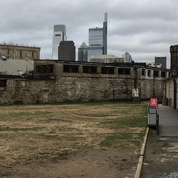 Eastern State Penitentiary - Baseball field of Eastern State penitentiary looking towards Phillly skyline - Landmarks & Historical Buildings Near Me - Philadelphia, Pennsylvania