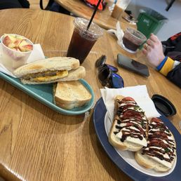 Sausage, egg, and cheese on sourdough and apple side Bruschetta toast Cold brew Sausage, egg, and cheese on sourdough and apple side Bruschetta toast Cold brew