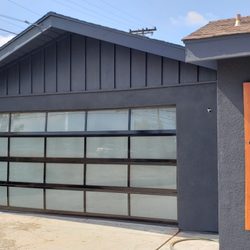 Adrian's Garage Door Service - Blk Aluminum, white laminate glass sectional Garage door.