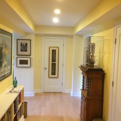Ashwood Construction & Remodeling - Foyer entrance with tray ceilings and custom built-in bookcase units