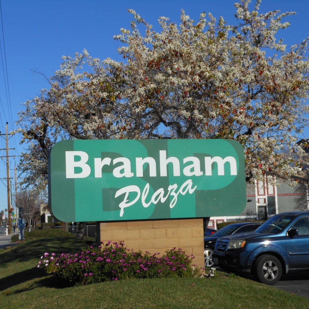 Branham Plaza - sign and spring blossoms - Shopping Centers Near Me - San Jose, California