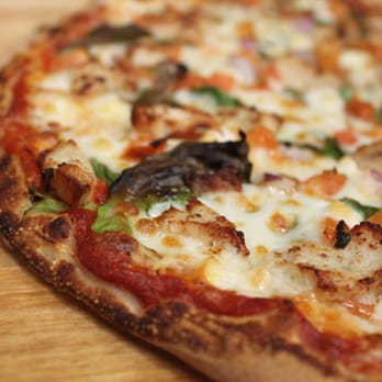 Dimitris Pizza - a whole pizza on a wooden table - Pizza Near Me - Halifax, Nova Scotia Dimitris Pizza - a whole pizza on a wooden table - Pizza Near Me - Halifax, Nova Scotia