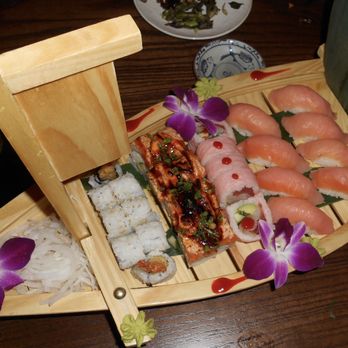 Blue Sushi Sake Grill - sushi boat (salmon nigiri, lion king roll, shrimp tempura roll) - Sushi Bars Near Me - Chicago, Illinois Blue Sushi Sake Grill - sushi boat (salmon nigiri, lion king roll, shrimp tempura roll) - Sushi Bars Near Me - Chicago, Illinois