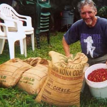 Rancho Aloha - Bruce shows off his fresh picked coffee 'cheery'. - Coffee & Tea Near Me