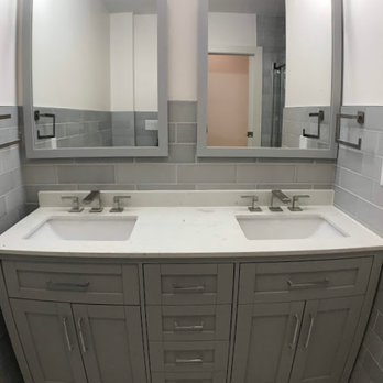Bicca Carpentry and Remodeling - a bathroom with two sinks and mirrors - General Contractors Near Me - Orlando, Florida Bicca Carpentry and Remodeling - a bathroom with two sinks and mirrors - General Contractors Near Me - Orlando, Florida