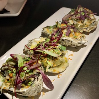 Continent Restaurant & Cigar Lounge - Yard Man Oysters - Cigar Bars Near Me - Atlanta, Georgia