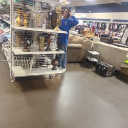 Goodwill Store - Bedford - I told this employee what was on the Goodwill store was wall.