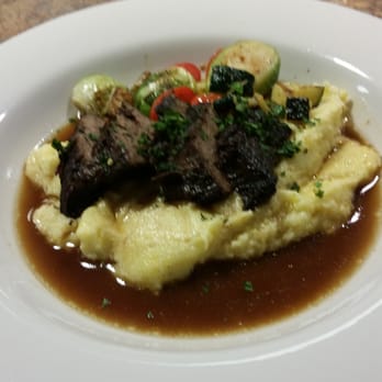 Chef City Grill - Boneless braised beef in a red wine reduction on top of cheesy polenta - New American Near Me - Kirkland, Washington