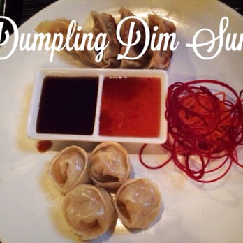 O-Ku - Pork Gyoza and Shrimp Shumai with den dashi and sweet chili sauce - Sushi Bars Near Me - Charleston, South Carolina O-Ku - Pork Gyoza and Shrimp Shumai with den dashi and sweet chili sauce - Sushi Bars Near Me - Charleston, South Carolina