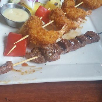 The Tilted Tiki - Yummy coconut shrimp and steak kabobs - Cocktail Bars Near Me - Stillwater, Minnesota The Tilted Tiki - Yummy coconut shrimp and steak kabobs - Cocktail Bars Near Me - Stillwater, Minnesota