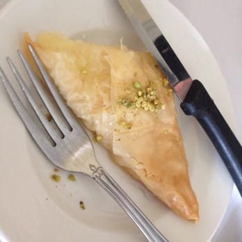 Cleopatra - I forgot what this was called but it was a custard inside with honey drizzled over it served warm. It's pretty good! - Mediterranean Near Me - Harvey, Louisiana