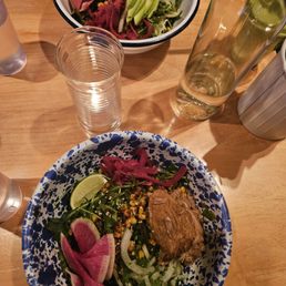 Bowl with avocado (top) and bowl with carnitas (bottom)