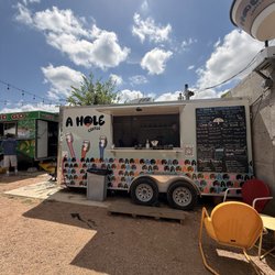 Behind the wall & where the coffee bar is