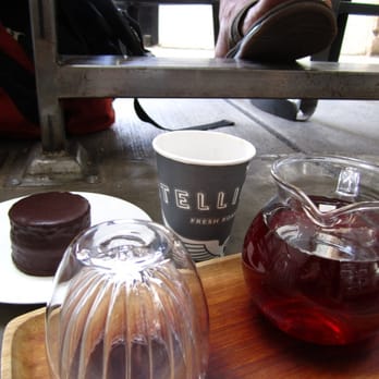 Intelligentsia Coffee - my earl grey tea (mediocre) and some guy's feet (hairy) - Coffee & Tea Near Me - Venice, California