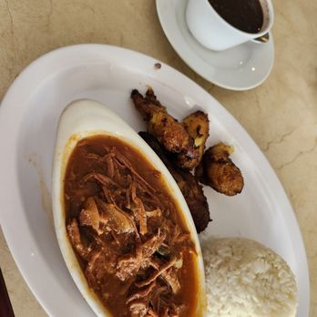 Don Carlin - ropa vieja (shredded beef in tomatoe sauce) with arroz (rice), fréjoles negros (black beans), and plátanos maduros (fried ripe plantains) - Cuban Near Me - Sunrise, Florida