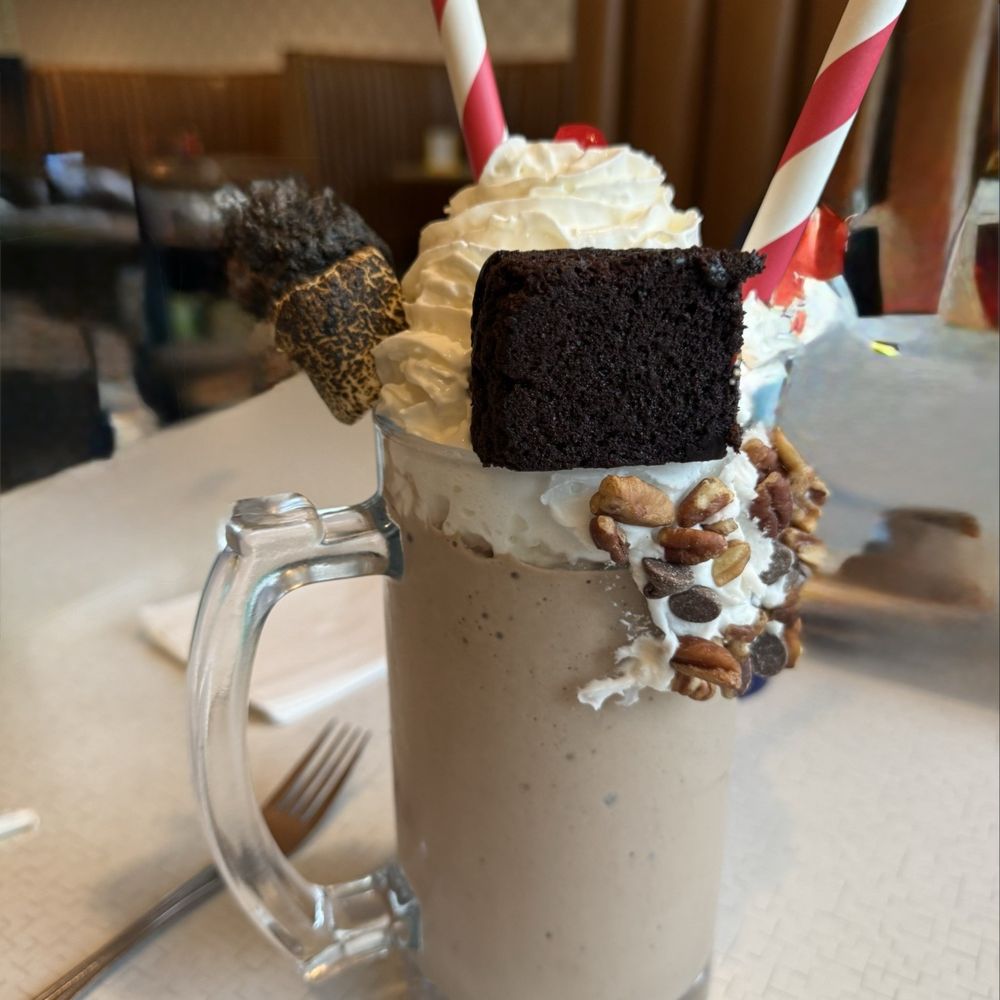 Mad Eats - The Chunk shake; with pecans and chocolate chips on the side and topped with a brownie and toasted marshmallows - Desserts Near Me - Owasso, Oklahoma