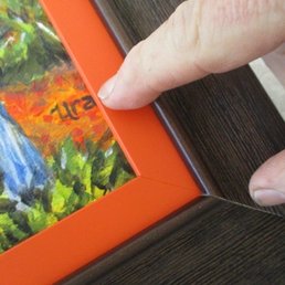 Frame covers up substantial portion of the artwork, and partial signature of the artist Frame covers up substantial portion of the artwork, and partial signature of the artist