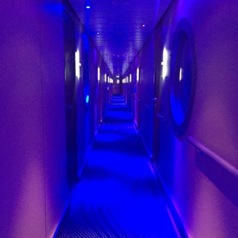 Norwegian Getaway - Hallway of the studio suite- at night it lite up blue and purple. Loungy hallway music was an added touch - Tours Near Me
