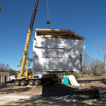 Tillman Building Services - a crane lifting a house - Roofing Near Me - Jacksonville, Florida Tillman Building Services - a crane lifting a house - Roofing Near Me - Jacksonville, Florida