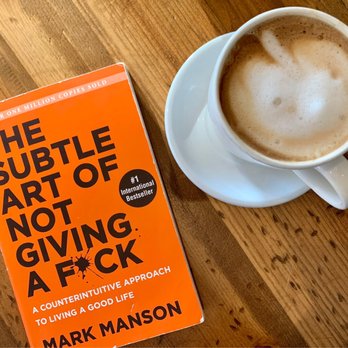 Asmara Coffee House - Flat white and current read - Coffee & Tea Near Me - London, Ontario