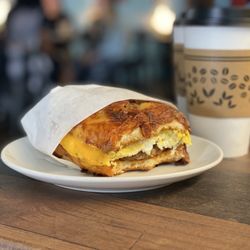 Breakfast Bagel Sandwich with sausage and Banana Cream latte