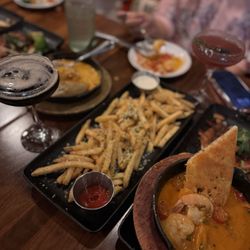 Parmesan Garlic fries, garlic shrimp & espresso martini from Happy Hour menu 10.10.25