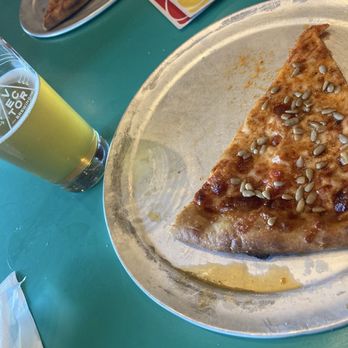 Vector Brewing - Sunflower pizza, beer in a Vector Brewing branded glass, deck of Uno cards - Brewpubs Near Me - Dallas, Texas